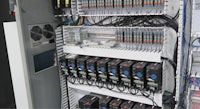 a rack of electronic equipment in a factory